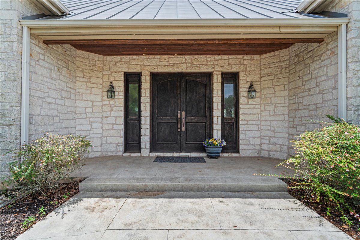 167 Wimberley Ranch Drive Wimberley, TX 78676 - Photo 5 of 40 a front view of a house with a yard
