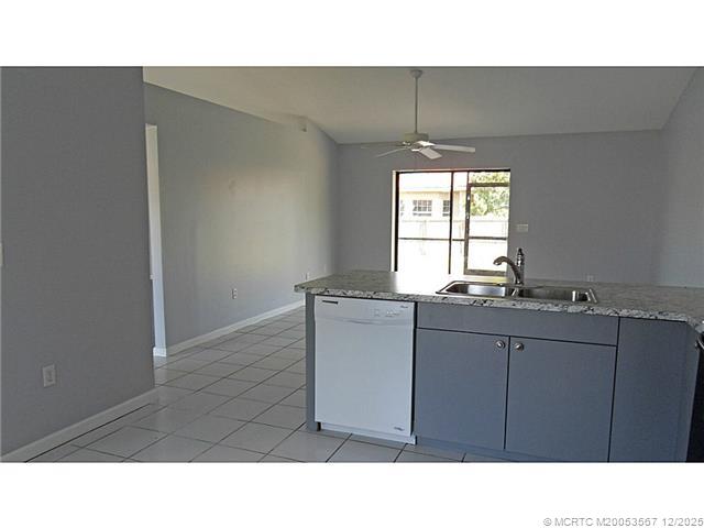 699 Southwest Hoffenberg Avenue Port St. Lucie, FL 34953 - Photo 11 of 26 Kitchen. Kitchen opens into family room