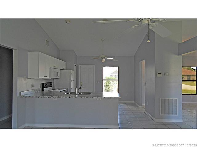 699 Southwest Hoffenberg Avenue Port St. Lucie, FL 34953 - Photo 25 of 26 Kitchen. Open floor plan