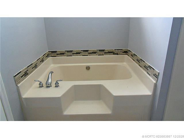 699 Southwest Hoffenberg Avenue Port St. Lucie, FL 34953 - Photo 14 of 26 Master Bath/Spa. Garden tub with tile accents