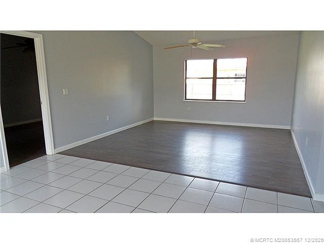699 Southwest Hoffenberg Avenue Port St. Lucie, FL 34953 - Photo 3 of 26 Living Room. Living room/dining room combo with vaulted ceiling