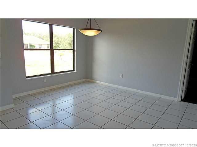 699 Southwest Hoffenberg Avenue Port St. Lucie, FL 34953 - Photo 6 of 26 Dining Room. Lots of natural light