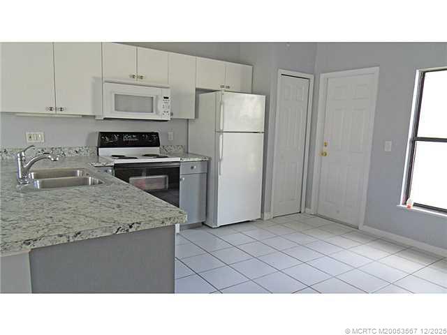 699 Southwest Hoffenberg Avenue Port St. Lucie, FL 34953 - Photo 8 of 26 Kitchen. Spacious kitchen