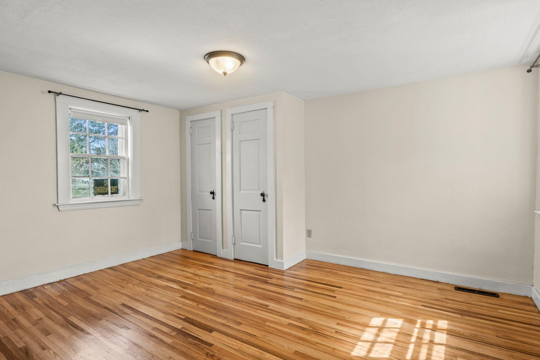 16 Oak Street Hyannis, MA 02601 - Photo 15 of 38 a view of empty room with wooden floor and fan