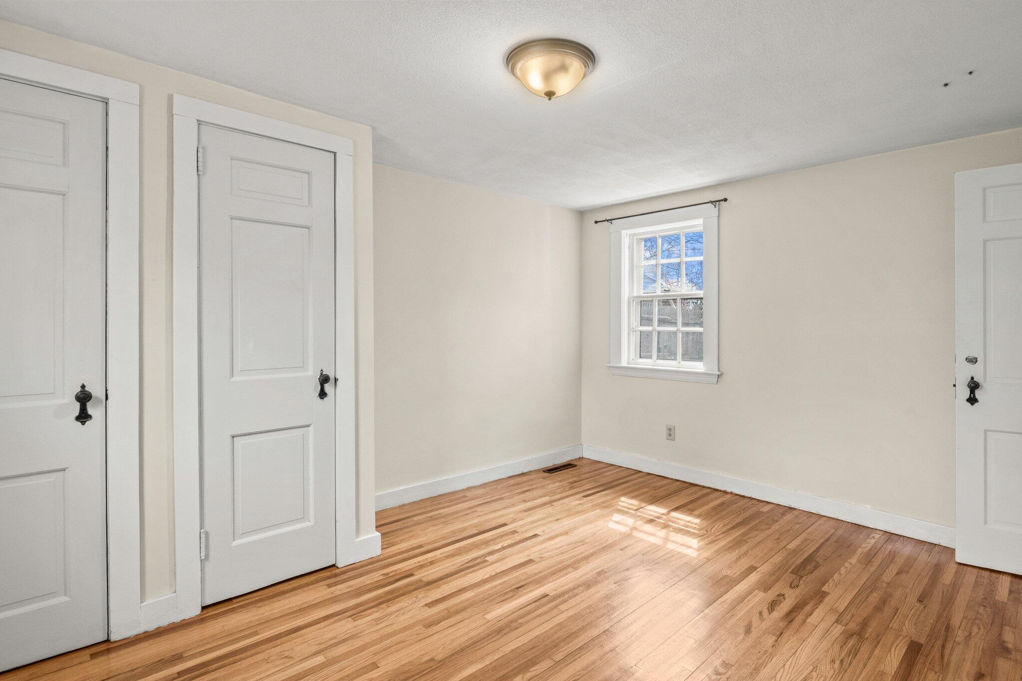 16 Oak Street Hyannis, MA 02601 - Photo 16 of 38 a view of empty room with wooden floor
