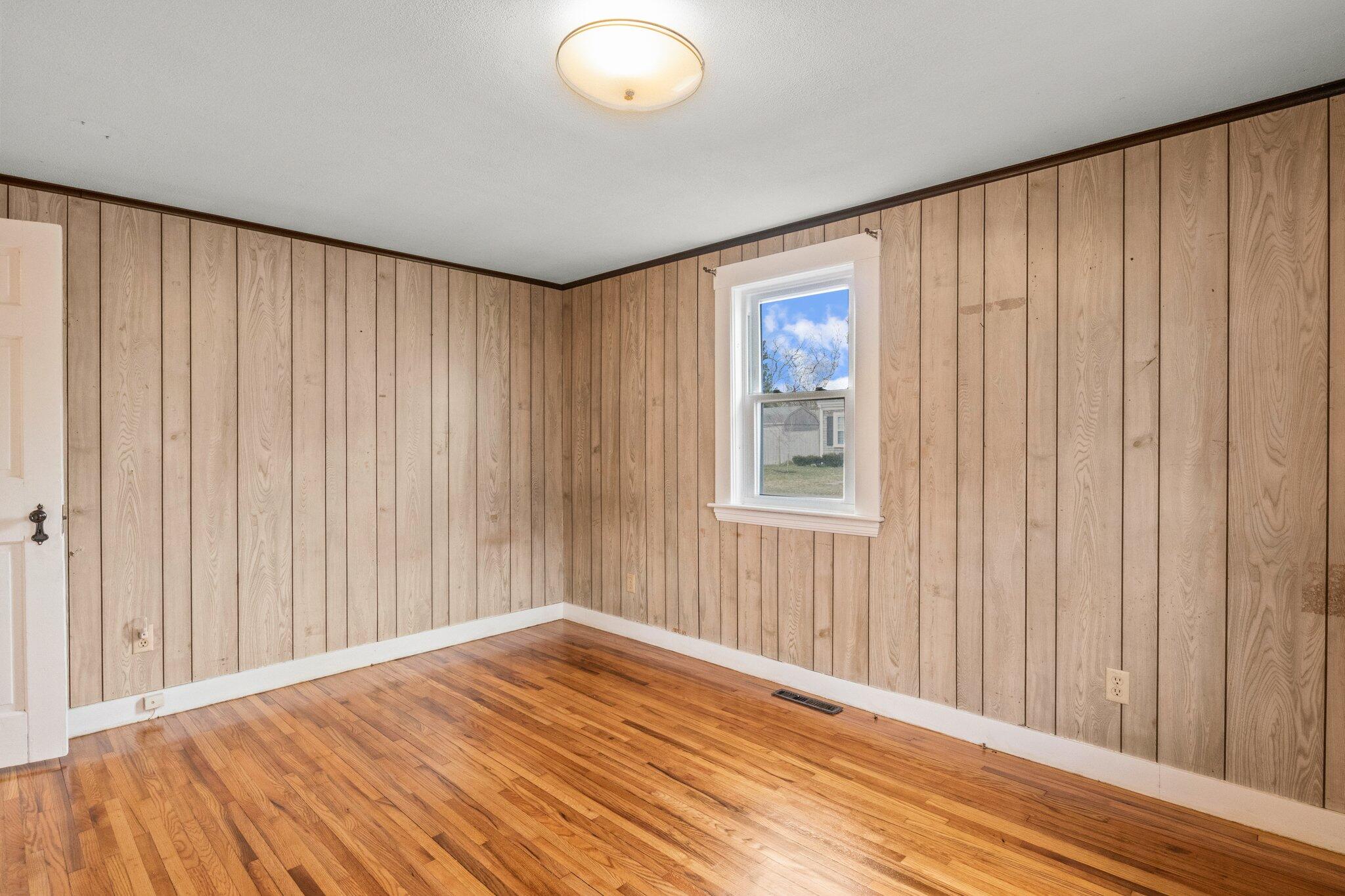 16 Oak Street Hyannis, MA 02601 - Photo 17 of 38 an empty room with wooden floor and windows