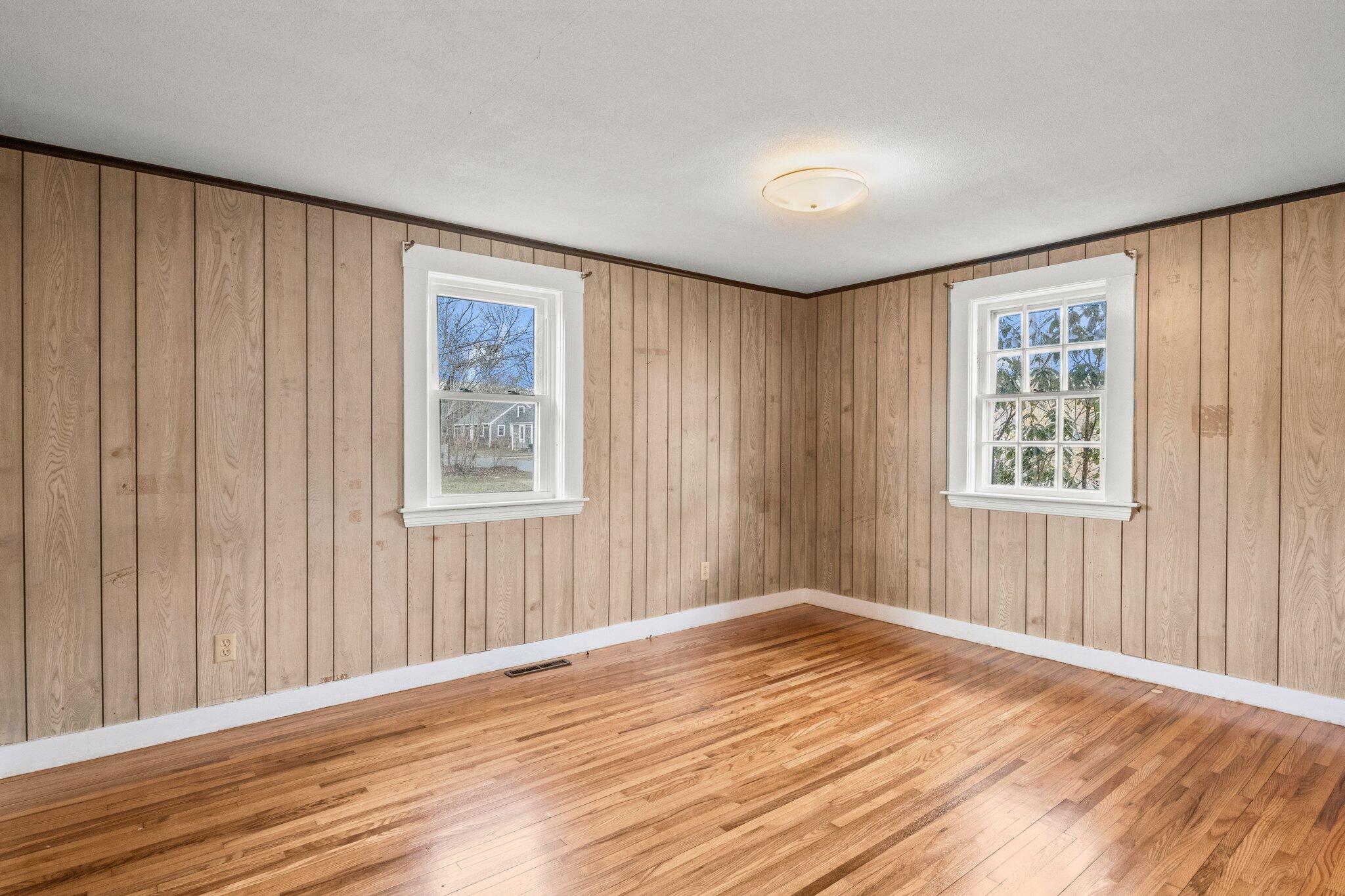 16 Oak Street Hyannis, MA 02601 - Photo 18 of 38 a view of an empty room with wooden floor and a window