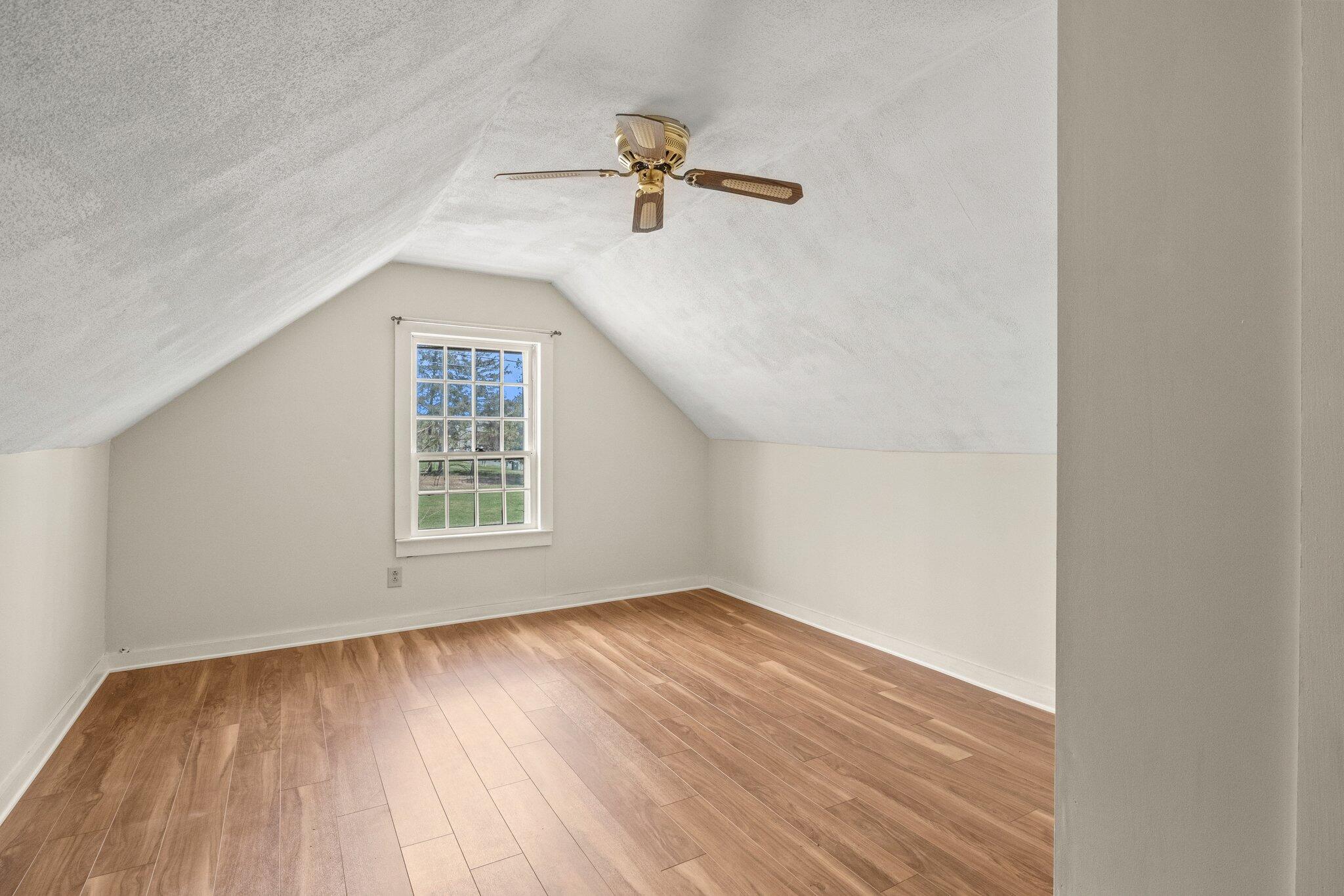16 Oak Street Hyannis, MA 02601 - Photo 23 of 38 wooden floor in an empty room with a window
