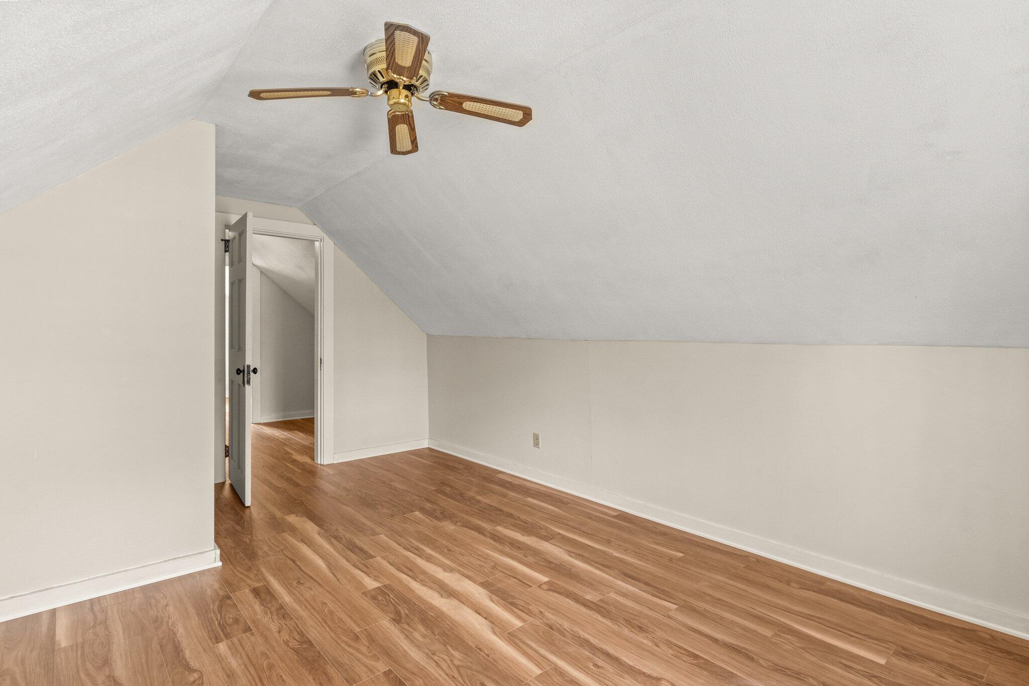 16 Oak Street Hyannis, MA 02601 - Photo 24 of 38 a view of a room with wooden floor and a ceiling fan