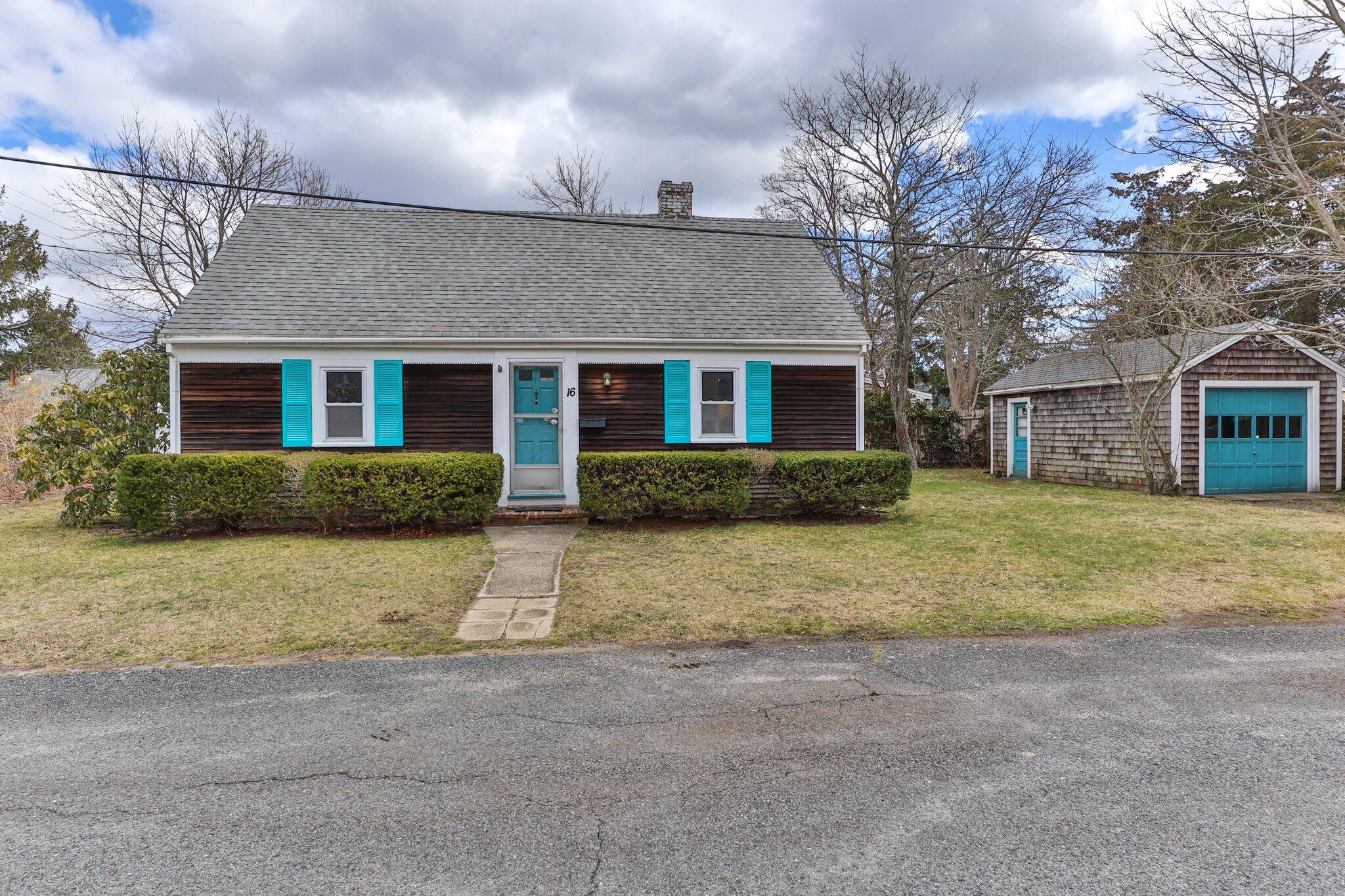 16 Oak Street Hyannis, MA 02601 - Photo 3 of 38 a front view of a house with a yard