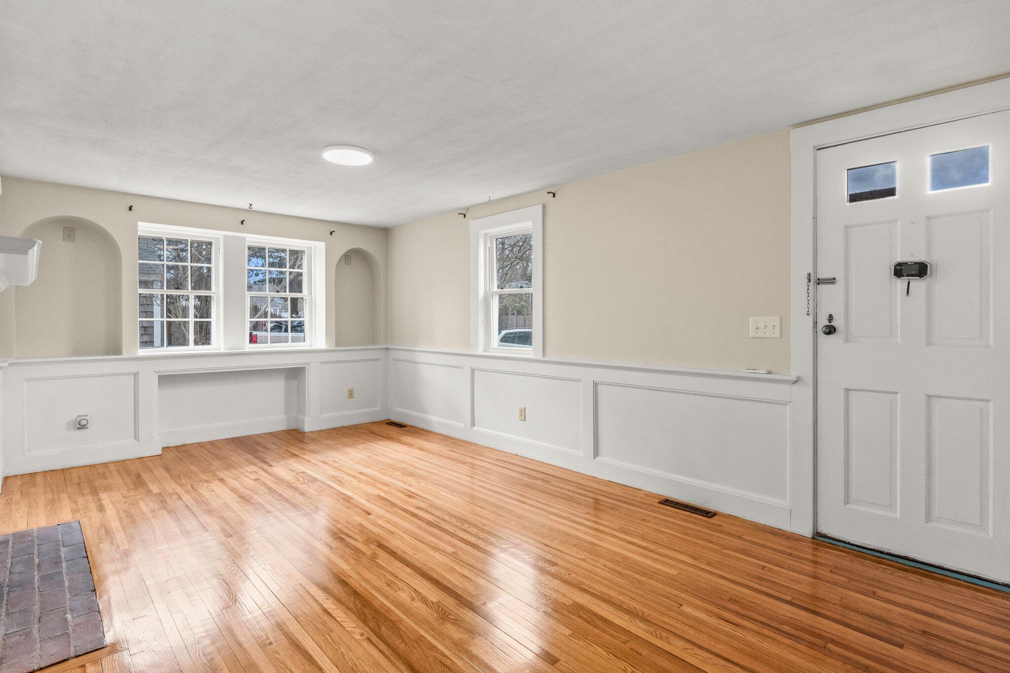 16 Oak Street Hyannis, MA 02601 - Photo 8 of 38 wooden floor in an empty room with a window