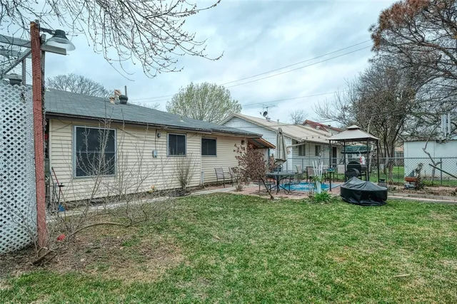 a front view of house with yard and seating area