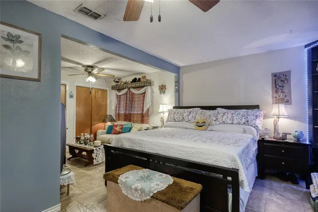 a bedroom with a bed and a dresser