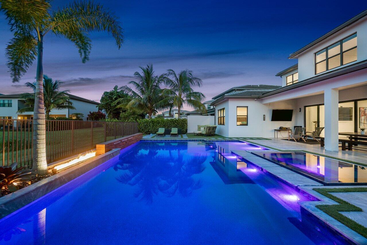 17166 Wandering Wave Avenue Boca Raton, FL 33496 - Photo 54 of 86 a view of swimming pool with outdoor seating