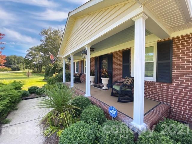 4622 Edgeland Road Edgemoor, SC 29712 - Photo 2 of 29 a view of a patio with couches chairs and potted plants