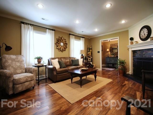 4622 Edgeland Road Edgemoor, SC 29712 - Photo 5 of 29 a living room with furniture and a fireplace