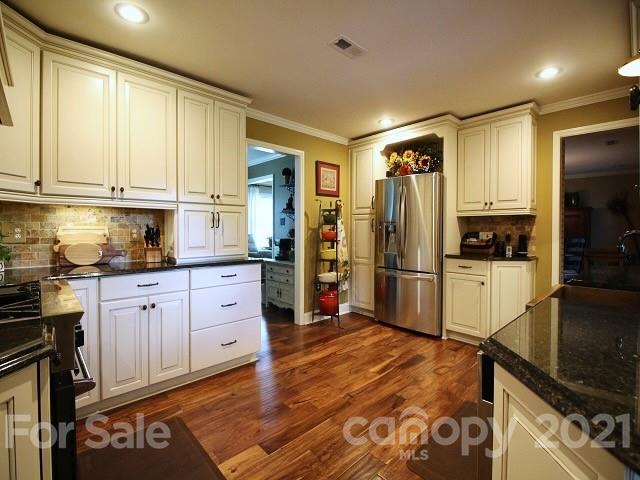 4622 Edgeland Road Edgemoor, SC 29712 - Photo 8 of 29 a kitchen with stainless steel appliances granite countertop a refrigerator sink and stove