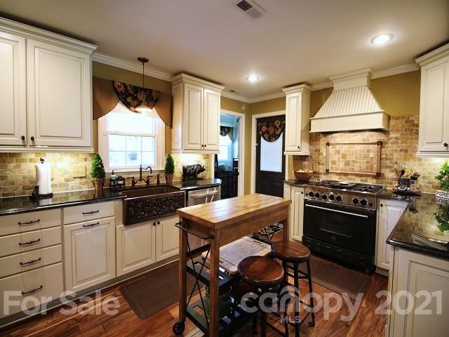 4622 Edgeland Road Edgemoor, SC 29712 - Photo 9 of 29 a kitchen with stainless steel appliances granite countertop a stove and a sink