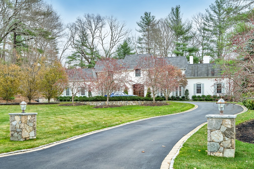 a view of a swimming pool and a yard
