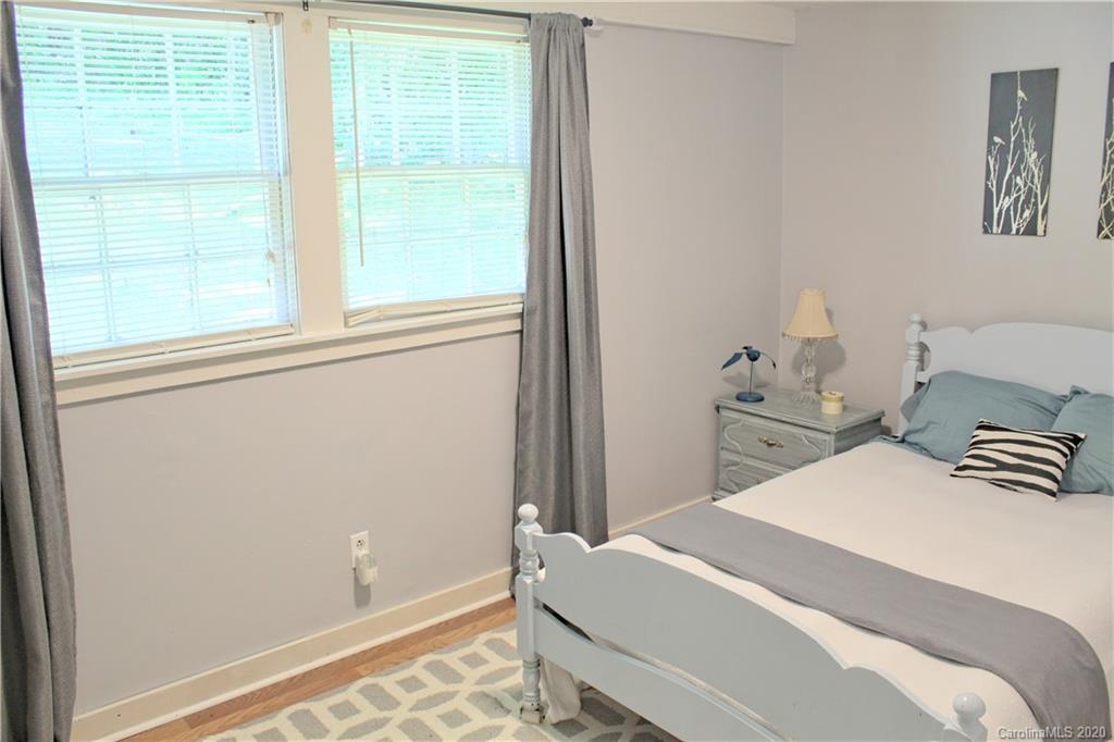 128 Murray Road Canton, NC 28716 - Photo 17 of 29 a bedroom with a bed and a window