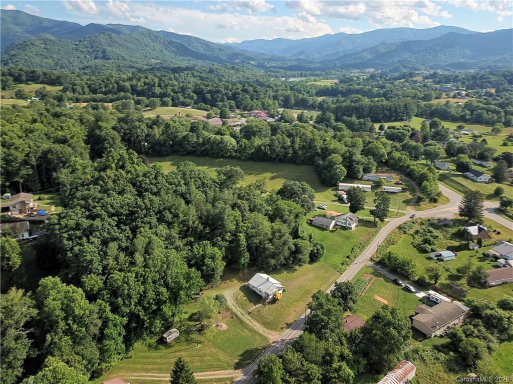 128 Murray Road Canton, NC 28716 - Photo 21 of 29 an aerial view of green landscape with trees houses and mountain view