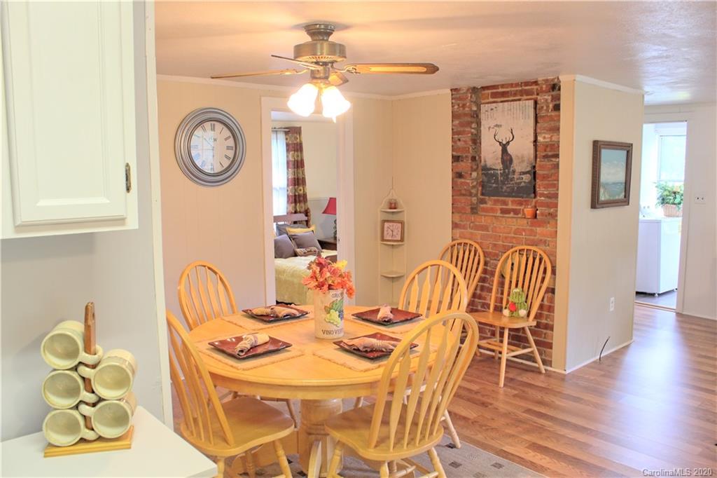 128 Murray Road Canton, NC 28716 - Photo 4 of 29 a view of a dining room with furniture and wooden floor