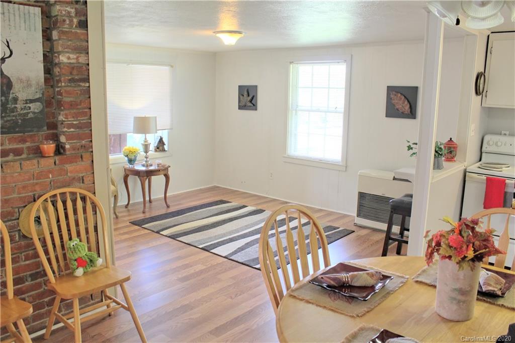 128 Murray Road Canton, NC 28716 - Photo 7 of 29 a bedroom with a bed and a chair
