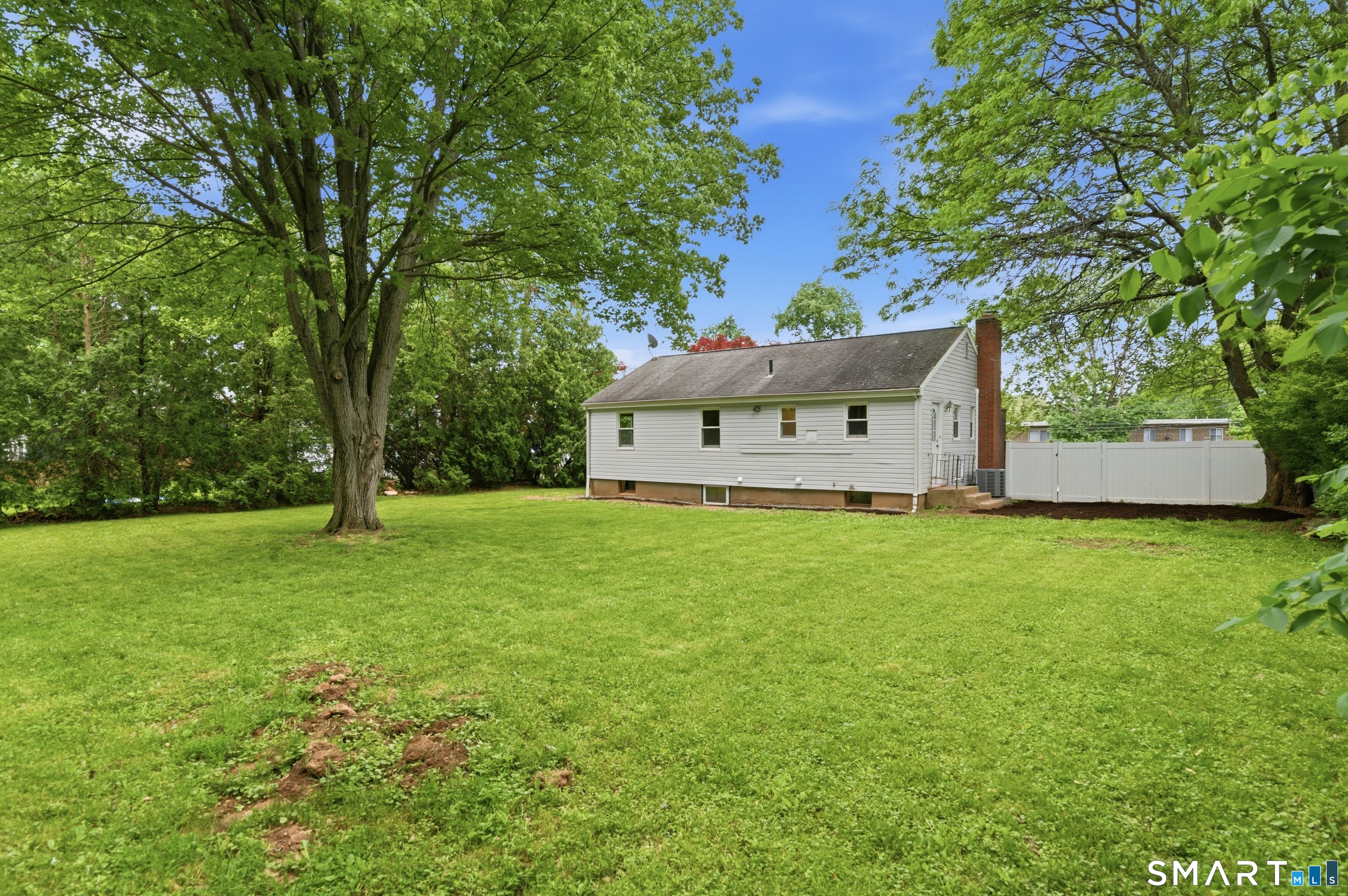 149 Mill Street Wethersfield, CT 06109 - Photo 26 of 29 a view of a house with a backyard