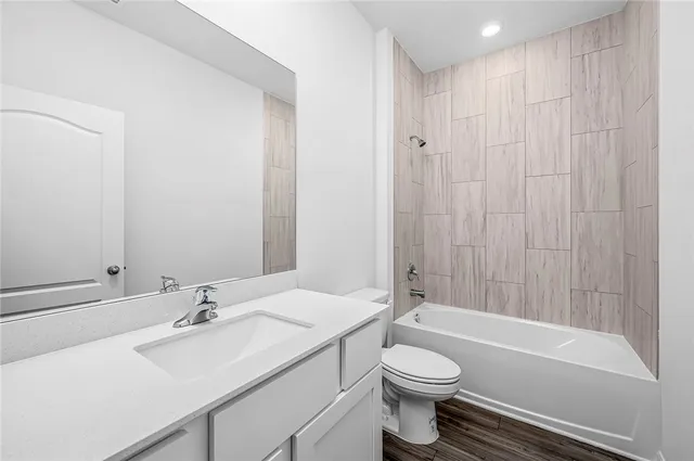 a bathroom with a sink a toilet and a bathtub