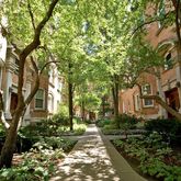 a pathway of a house with a yard