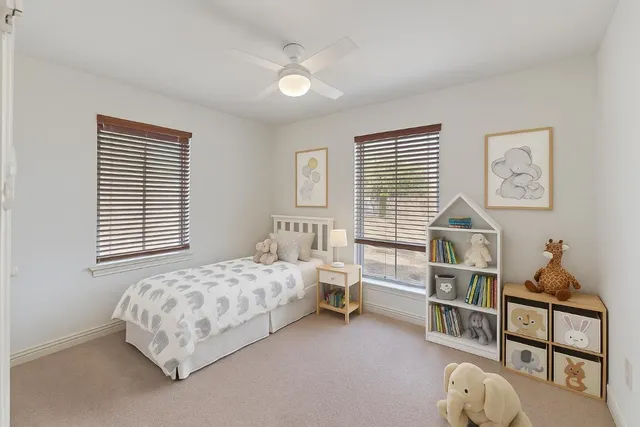 a bedroom with furniture and a window