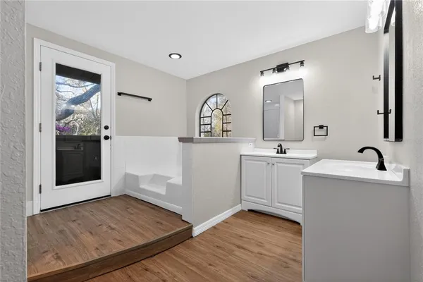 a view of bathroom with dual sinks