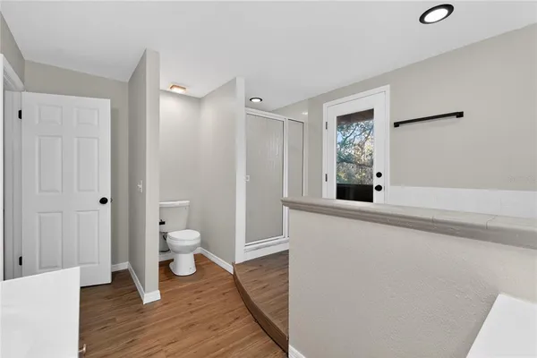 a view of room that has a white walls