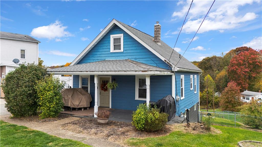 2065 Brodhead Road Aliquippa, PA 15001 - Photo 2 of 6 a front view of a house with a yard