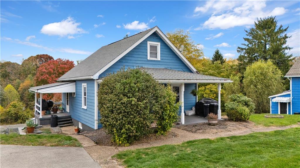 2065 Brodhead Road Aliquippa, PA 15001 - Photo 3 of 6 a front view of a house with garden