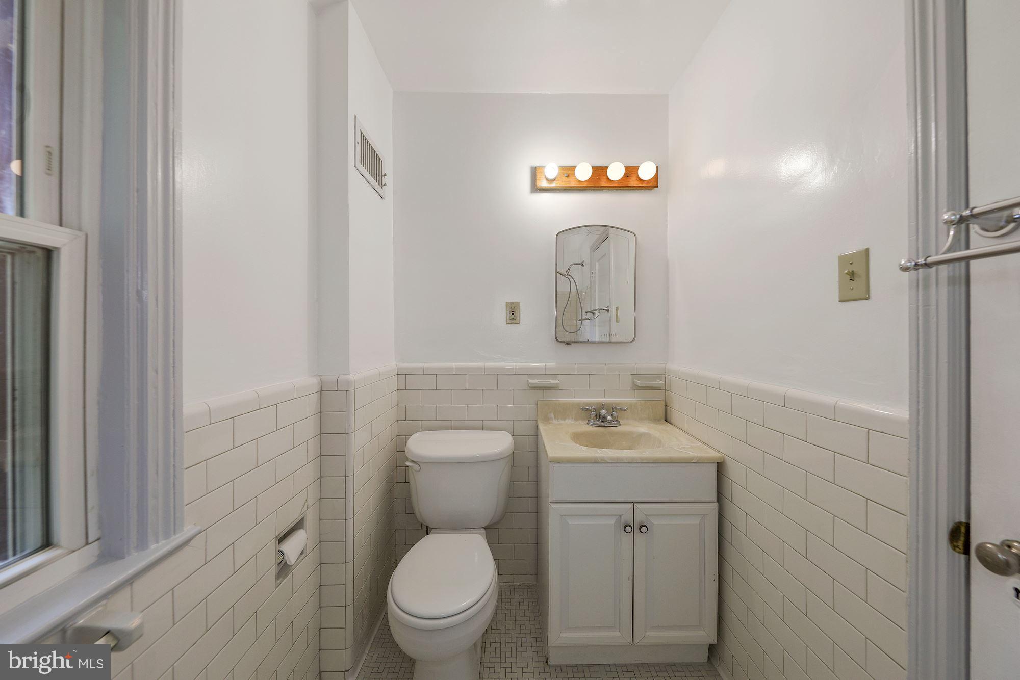 8108 Piney Branch Road Silver Spring, MD 20910 - Photo 16 of 32 Upper level bath with subway tile