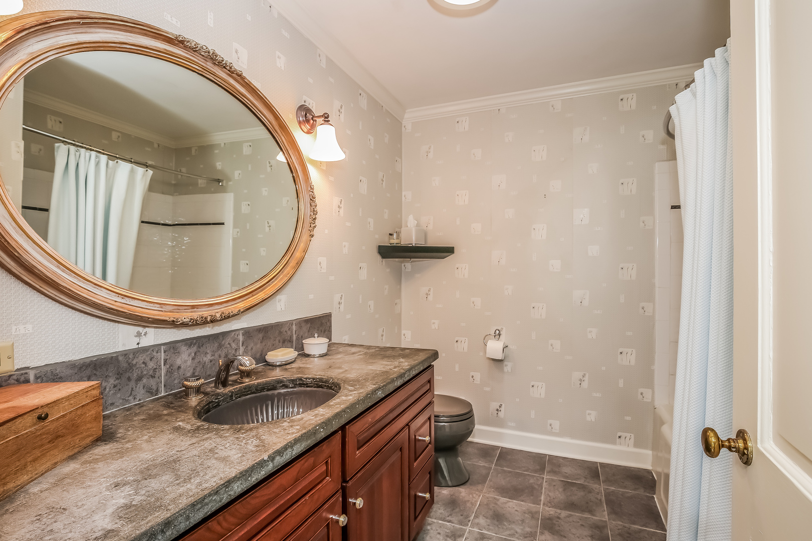 1020 East Westleigh Road Lake Forest, IL 60045 - Photo 22 of 31 a bathroom with a granite countertop sink a mirror and shower