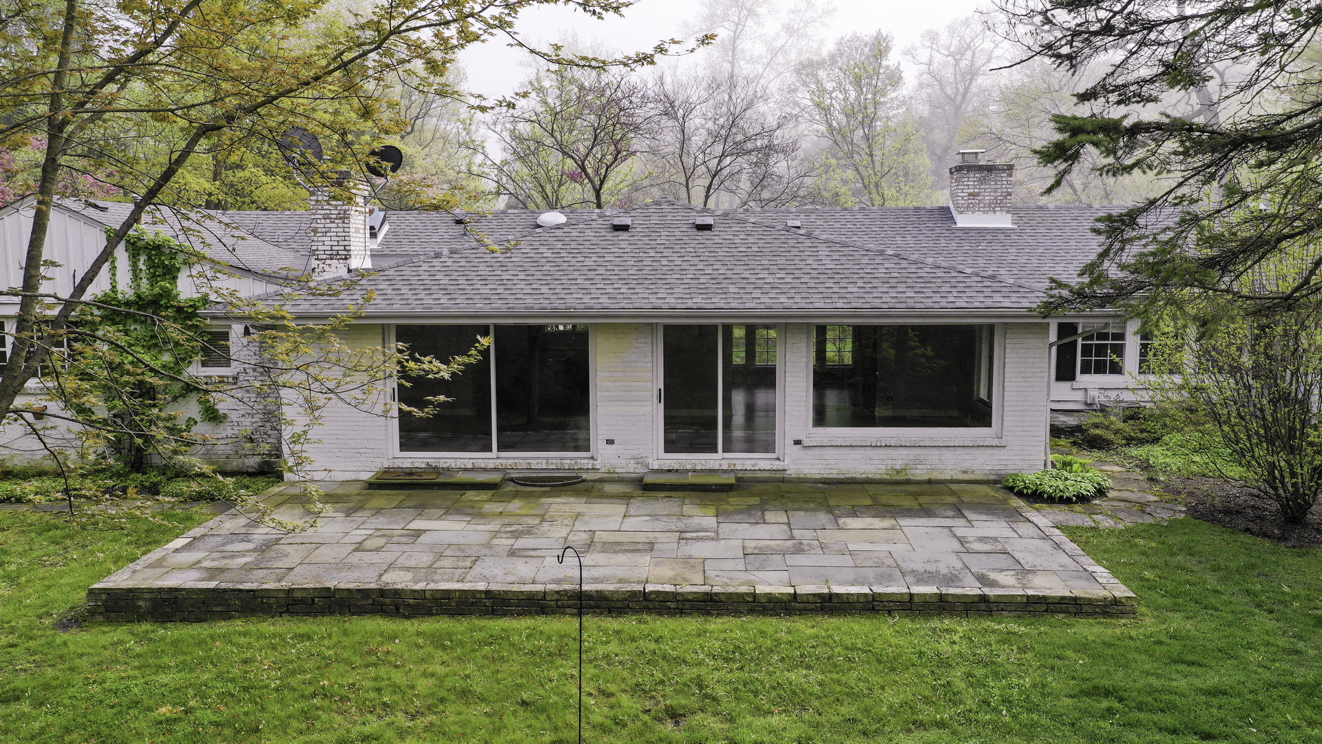 1020 East Westleigh Road Lake Forest, IL 60045 - Photo 26 of 31 a front view of a house with a yard