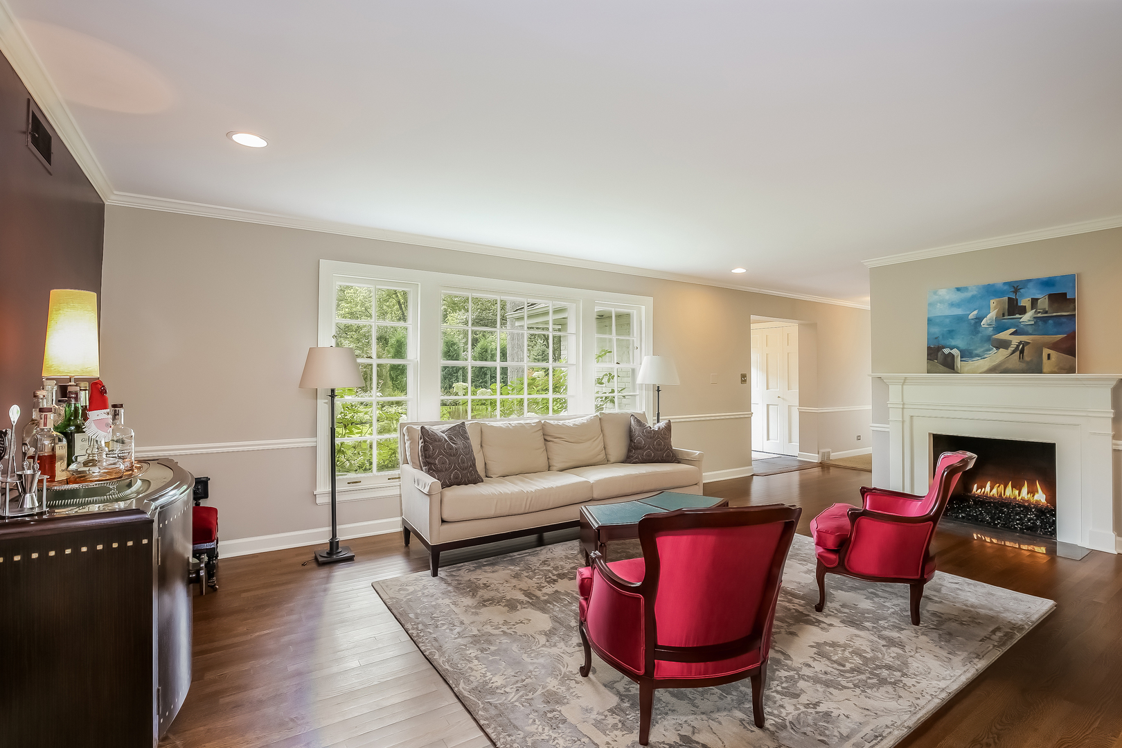 1020 East Westleigh Road Lake Forest, IL 60045 - Photo 7 of 31 a living room with furniture a fireplace and a large window