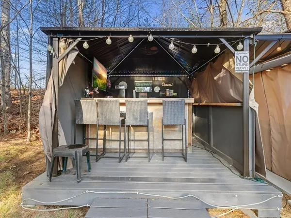 a patio with a table and chairs