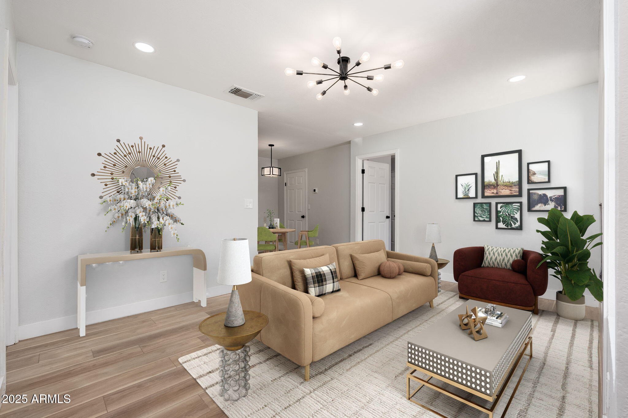 a living room with furniture and a chandelier