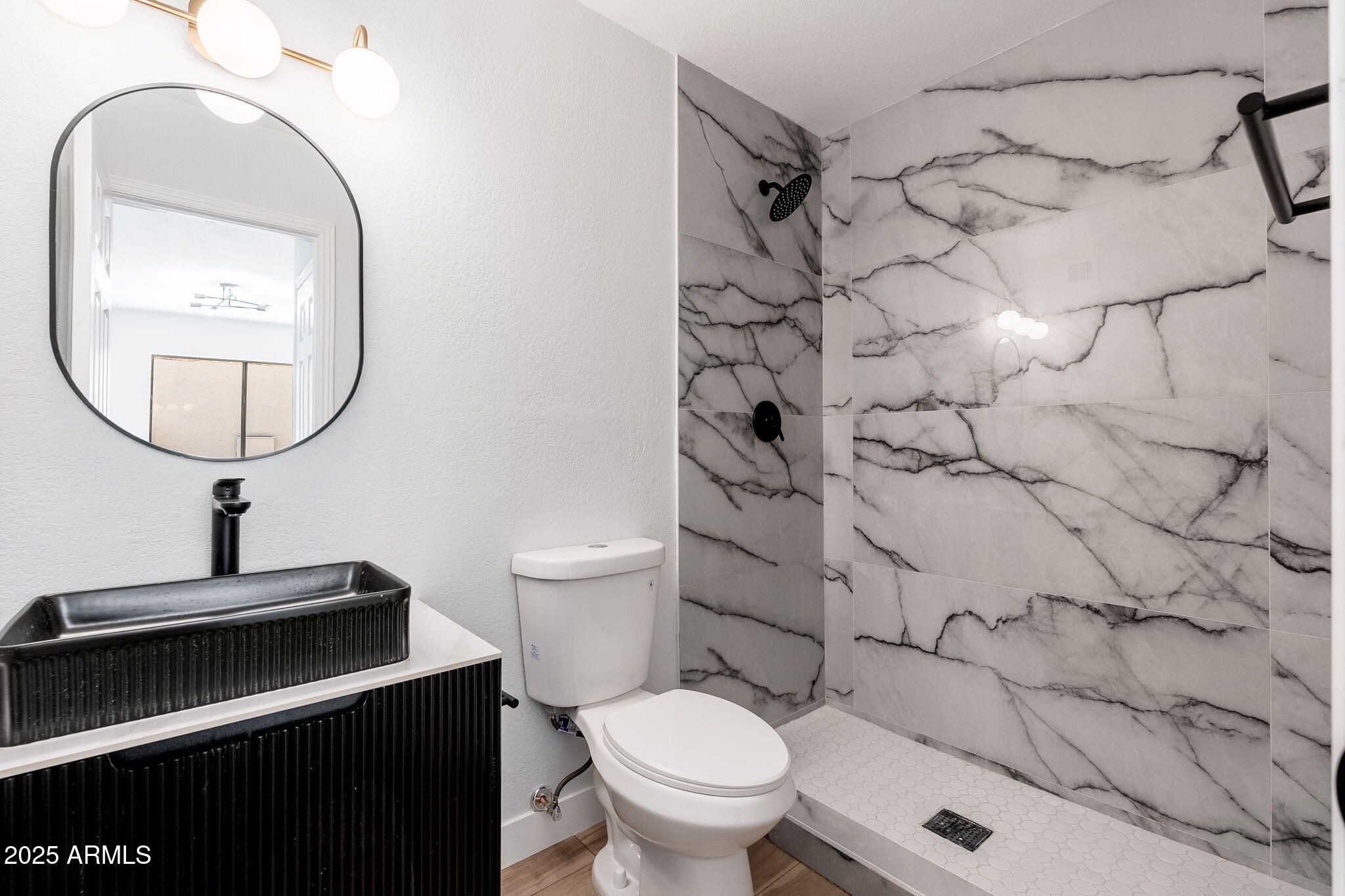 3511 East Baseline Road, Unit 1200 Phoenix, AZ 85042 - Photo 13 of 28 a bathroom with a toilet sink and mirror