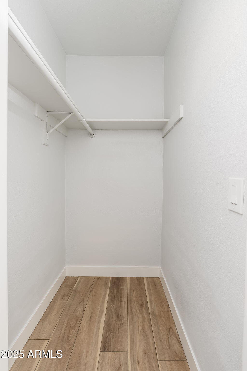 3511 East Baseline Road, Unit 1200 Phoenix, AZ 85042 - Photo 14 of 28 a view of a room with wooden floor