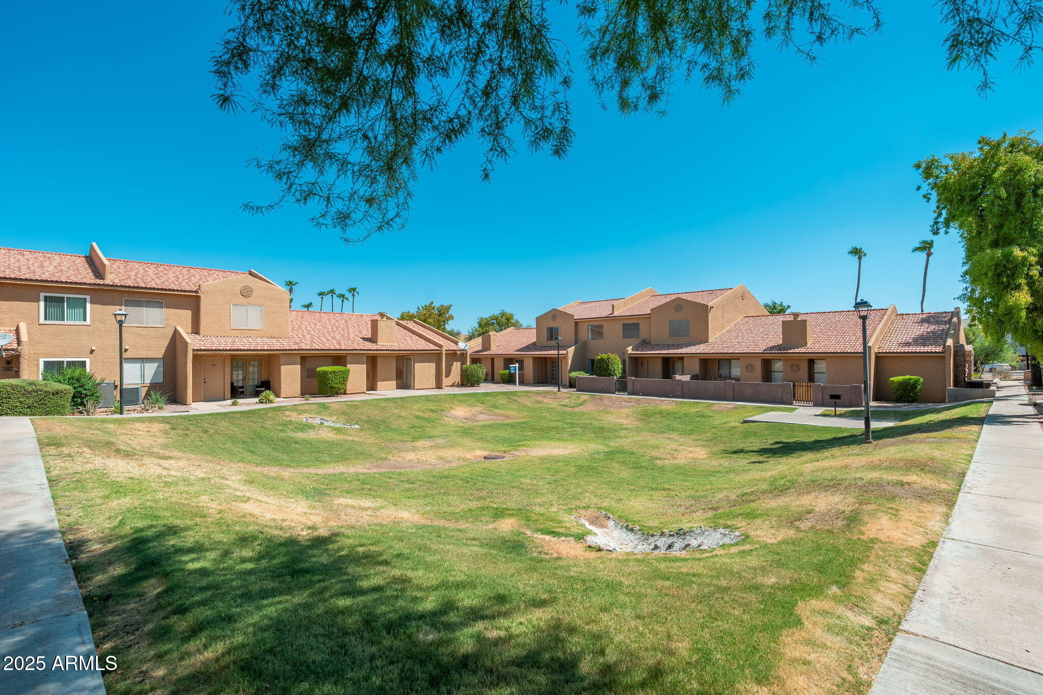 3511 East Baseline Road, Unit 1200 Phoenix, AZ 85042 - Photo 27 of 28 a view of a house with pool and a yard