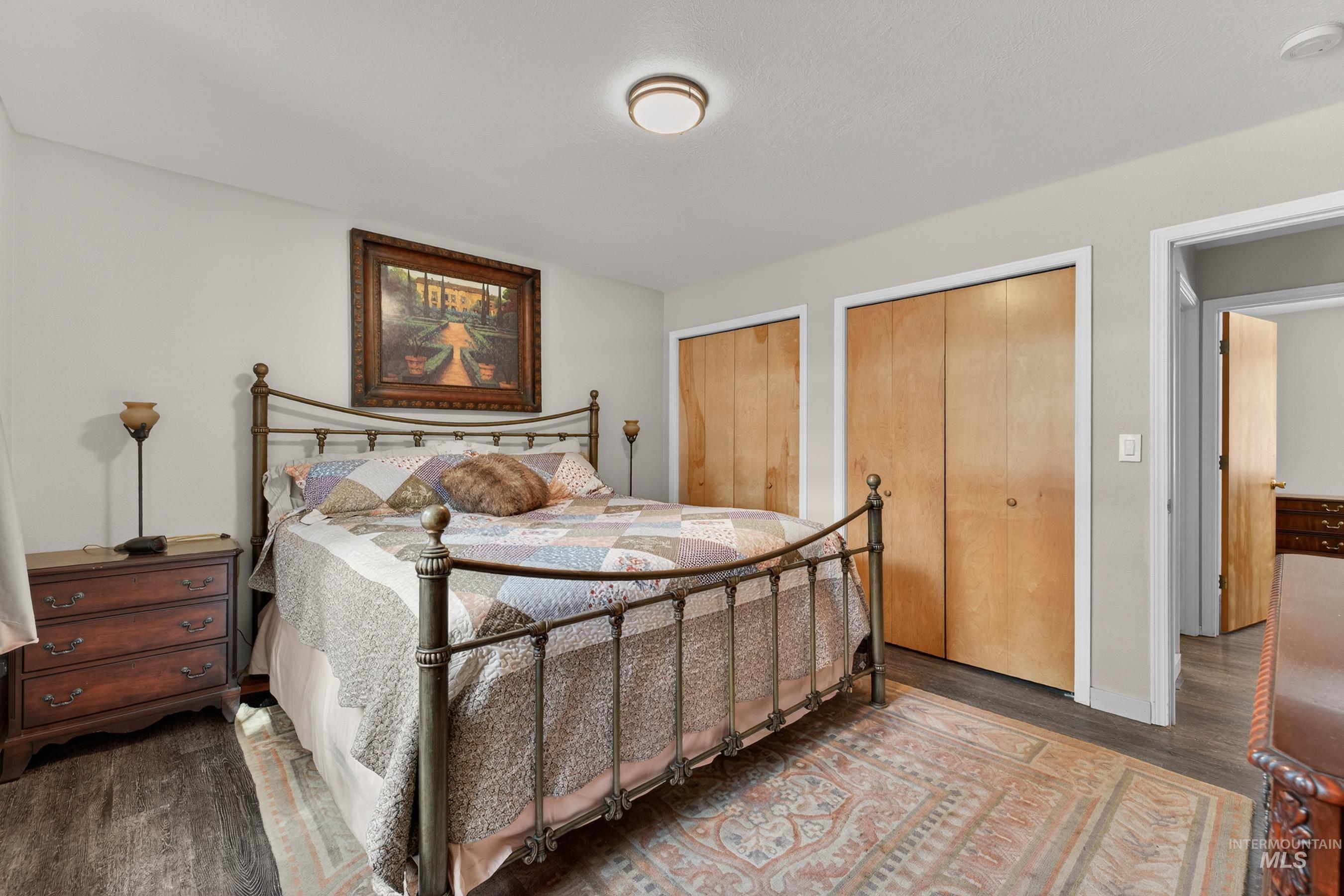 1801 Carico Road McCall, ID 83638 - Photo 13 of 30 Bedroom featuring two closets and wood finished floors