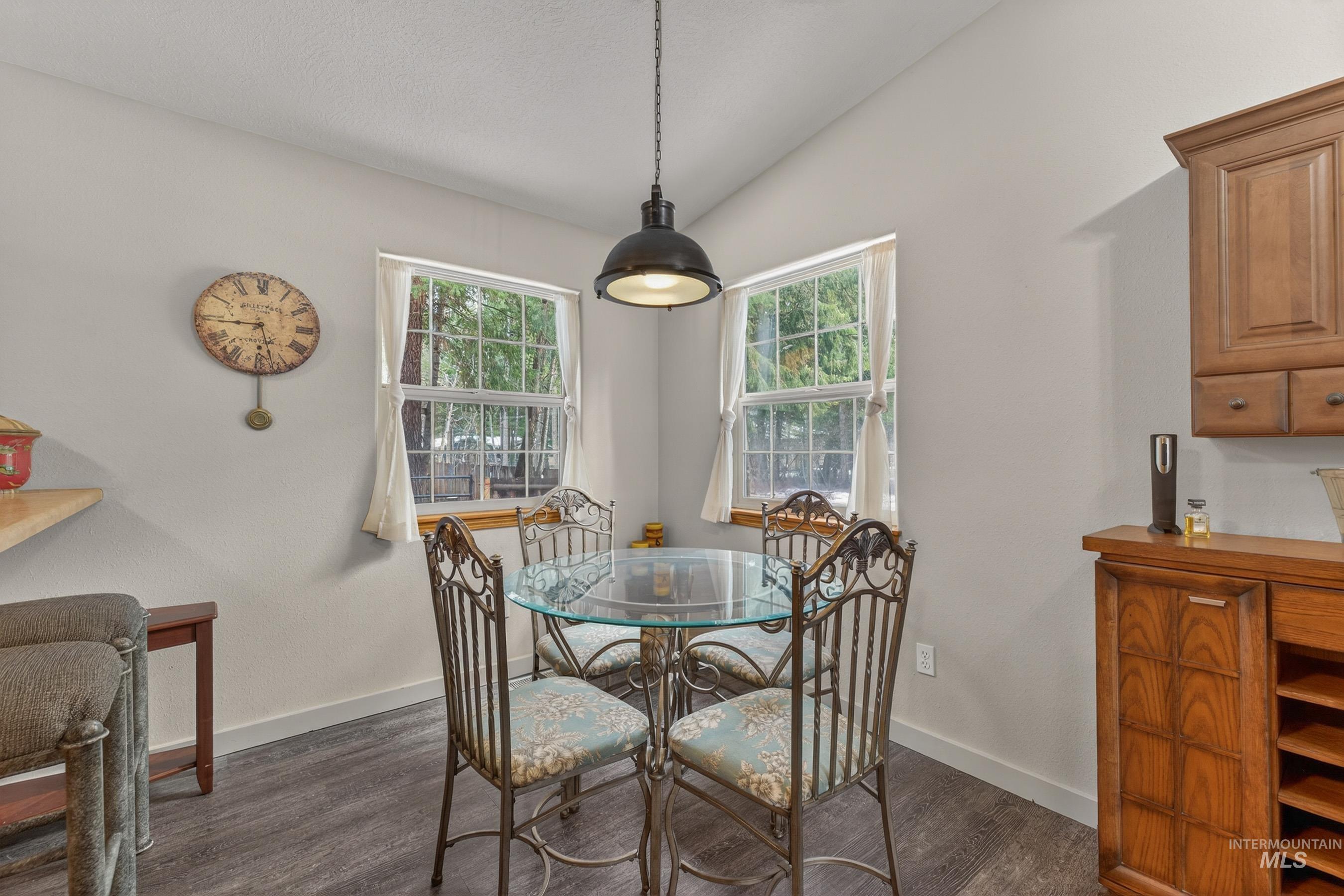1801 Carico Road McCall, ID 83638 - Photo 9 of 30 Dining room featuring dark wood-type flooring and lofted ceiling
