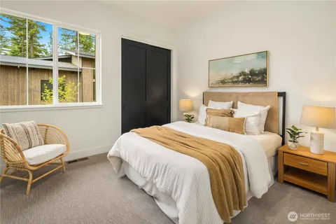 a bedroom with a bed and a couch