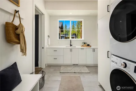 a view of a hallway with washer and dryer