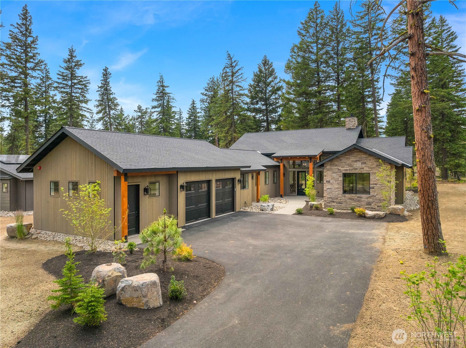 1950 Wanawish Loop Cle Elum, WA 98922 - Photo 25 of 34 a front view of a house with sitting area and garden