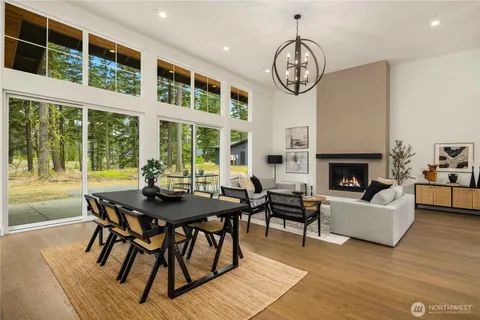 a view of a livingroom with furniture window and wooden floor